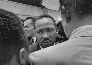 Martin Luther King Jr. Confronted by Police at Funeral of Medgar Evers, 1963 