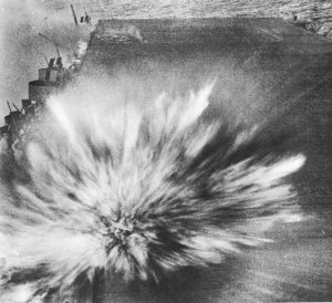 Japanese Bomb hits the flight deck of USS Enterprise, costing the photographer of this picture his life.  August 24, 1942 