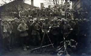 Curious German soldiers swarm around some of the first American prisoners taken in World War I, near Bathelémont, 1917. 