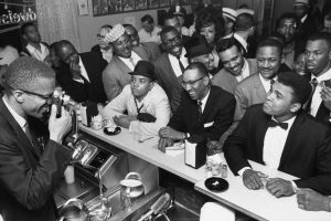 Muhammad Ali posed at a Miami soda fountain for Malcolm X in 1964.