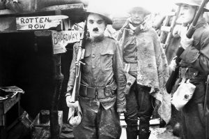 Charlie Chaplin and other actors in a trench on the set of the World War One silent comedy Shoulder Arms, 1918. 