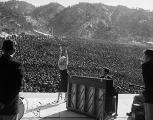 Marilyn Monroe on stage in front of thousands of troops, Korea, 1954.
