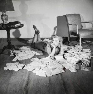 Marilyn Monroe with overwhelming amount of fan mail, 1952.