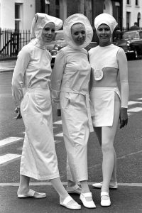 Models in futuristic Nurses uniforms designed by Pierre Cardin, 1970.