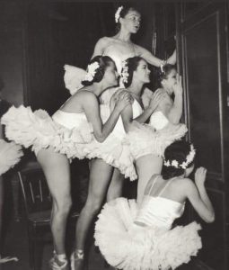 Ballerinas peeking into the men's locker room, Paris, 1948.