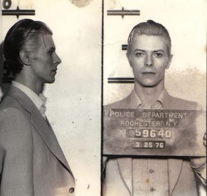 David Bowie mugshot, arrested, along with Iggy Pop, for marijuana possession in Rochester New York, 1976. 