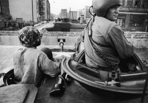 American forces, in foreground, face East German forces across the newly built Berlin Wall in 1961 