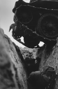 Red Army soldiers in the trenches and the T-34 tank, which overcomes the trench, passing over them. WWII. 