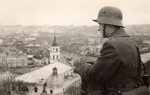 A Lithuanian soldier atop Gediminas' Tower overlooks the recently annexed city of Vilnius in 1939 