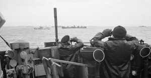 Officers keep watch for U-Boats on the bridge of an unnamed destroyer escorting a convoy, somewhere in the Atlantic October 1941 