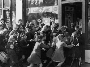 Children rush into a candy store following the end of 'sweets rationing' 1953 