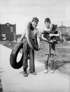 Two young boys collecting rubber for the war effort, Montreal, 1942.