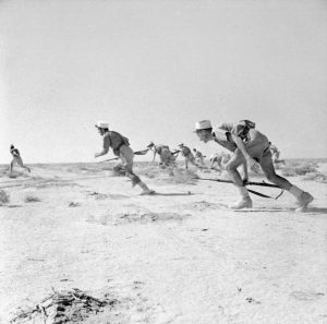 Soldiers in the French Foreign Legion charging in Bir Hacheim, June 1942 