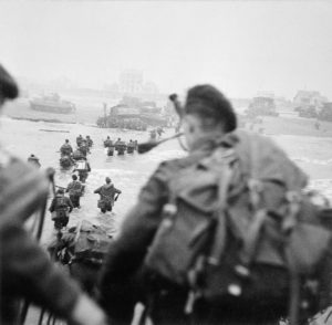 British 2nd Army commandos of 1st Special Service Brigade landing from an LCIS (Landing Craft Infantry Small) on 'Queen Red' Beach, SWORD Area, at la Breche, at approximately 8.40 am, 6 June 1944 