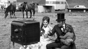 Rex Harrison and Samantha Eggar watch World Cup final with Chee-Chee.