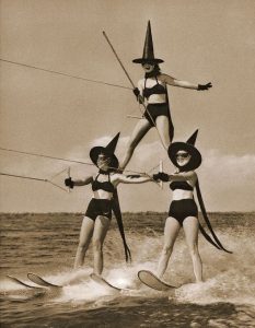Halloween at Cypress Gardens, water skiing troupe as witches, 1955.