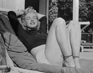 Iconic Marylin Monroe, relaxing at her luxurious Hollywood home, 1952.