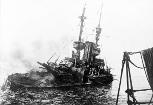 HMS Irresistible, abandoned and sinking in the Dardanelles during the Battle of Gallipoli, 18 March 1915 