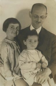 Anne Frank, along with her sister Margot and their father Otto, 1931.