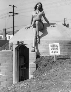 Mary Lou Miner perched atop a bomb shelter in Los Angeles, 1951.