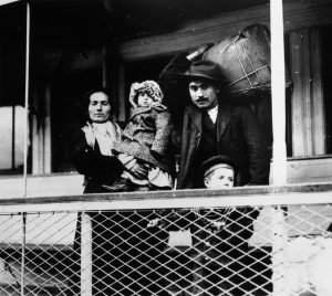 Italian immigrant family at Ellis Island, stepping stone of hope, 1955.