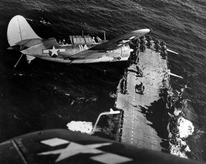 SB2C Helldivers in the landing pattern over the USS Hornet Pacific 1944.