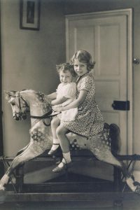 Princess Elizabeth and Princess Margaret riding a rocking horse,
1932.