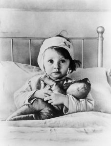 Eileen Dunne, 3-year-old girl, survived London air raid in 1940.