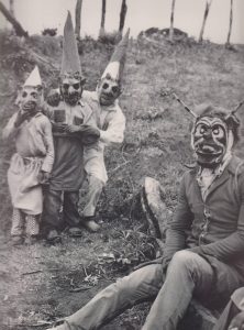 Community gathering, not horror-focused, Halloween in the early 1900s.