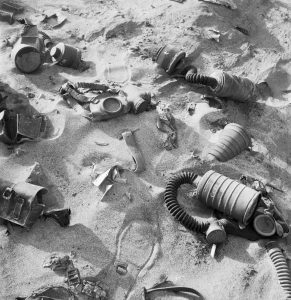 Abandoned Italian respirators lying in the sand, Western Desert, 1942.