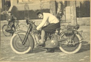 A rare sight of a woman on a Harley Davidson Sport, 1920s.