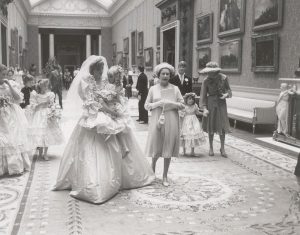 Princess Diana, holding her youngest bridesmaid Clementine, 1981.