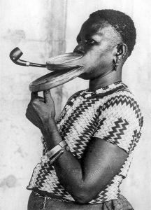 Extended mouthpiece for pipe smoking woman, New York circus, 1930s.