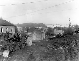 WWII: 7th Armored Division defends Belgium railroad crossing.