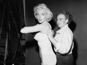 Iconic Hollywood actress Marilyn Monroe getting fitted, 1953.