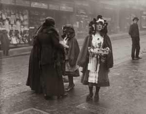 Irish girls sustain economy via shamrock selling, Dublin, 1916.