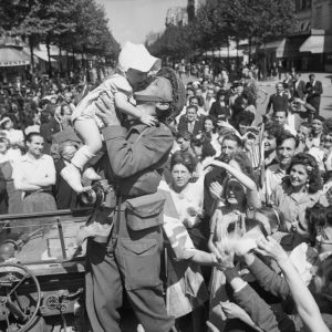 Iconic war bond, Soldier's kiss with baby in freed Paris, 1944.