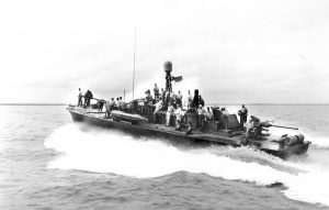 PT-490, an 80-foot Elco motor torpedo boat, embarked on a critical mission in the Philippines, 1945.