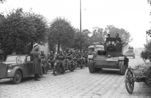 A Soviet T-26 rolls past a German motorcycle unit during a joint victory parade in Brest-Litovsk on September 22, 1939. 