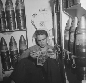 Sailor reads a comic book aboard the USS Doran, 1942 