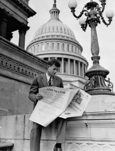 JFK looks through real estate listings to find housing, November 1946.