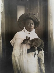 Young Kenyan women holding a Dik-Dik, Mombasa, 1909.