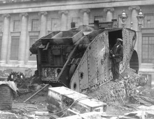 A man dismantling a tank with a blow torch, during the post war disarmament in Germany. 1920 