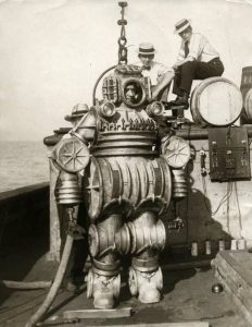 1920s diving suits, Iron helmets, air pumped from surface.