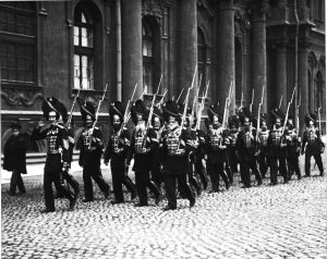 Imperial Russian Palace Grenadiers marching in front of the Winter Palace in St Petersburg. All members were enlisted men that saw action against the enemy and were decorated with Order of St. George, Russia's highest military decoration. 1914. 