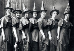 Women wearing improvised witch costume, 1910.