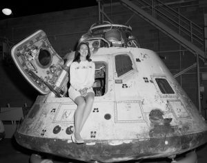 Miss NASA poses with the Apollo 8 space capsule, 1971.