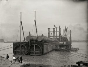 Sinking a cast section of Michigan Central Railroad Company tunnel, Detroit, ca.1910 