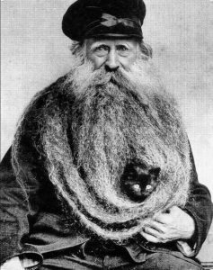 Louis Coulon unique 13 foot long beard, a nest for his cats, 1904.