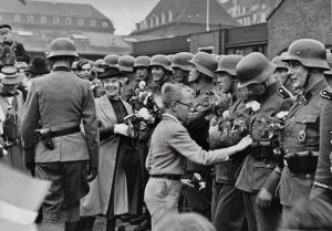 Danish civilians welcome the Danish Free Corps on its return from the Eastern Front in August 1942 